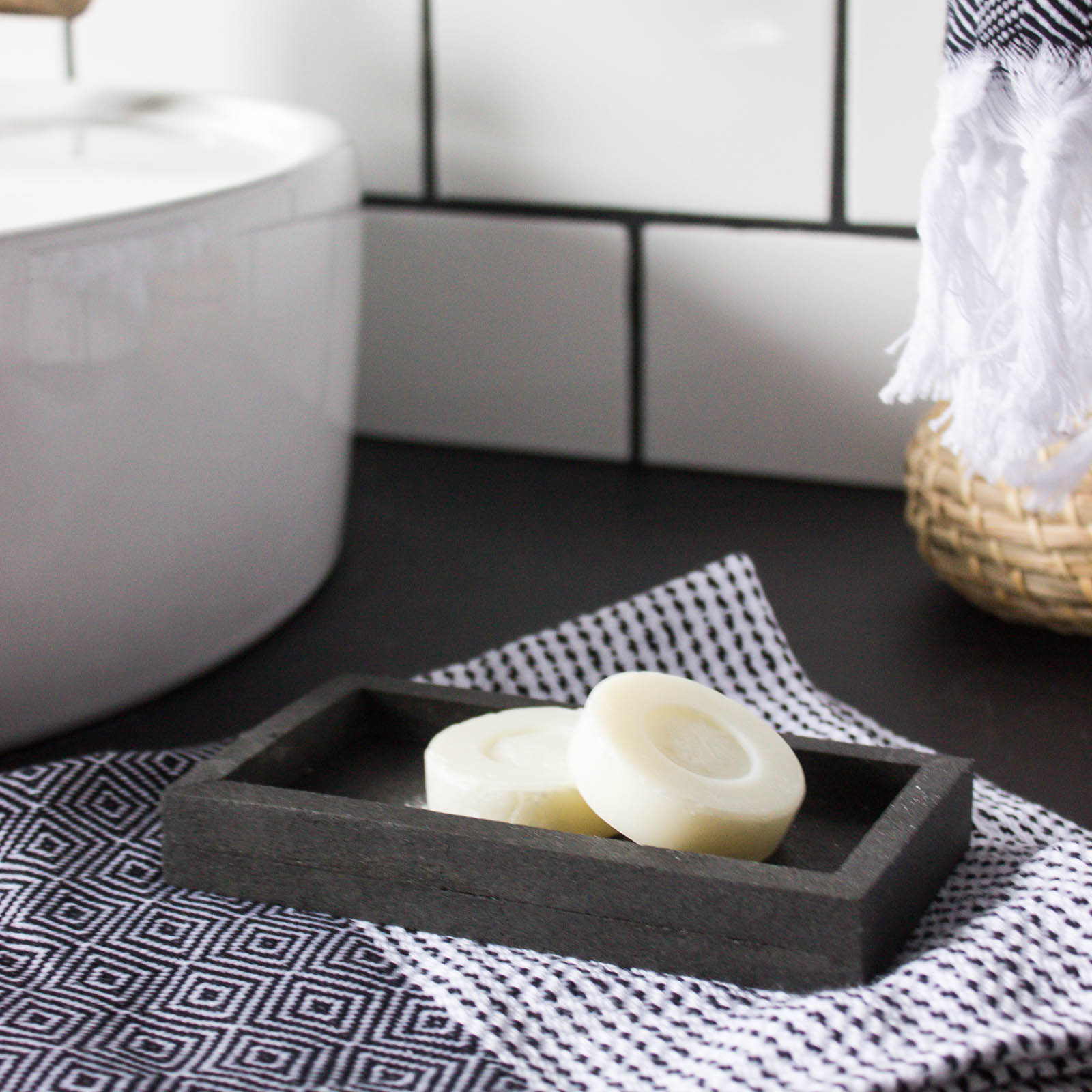Sleek modern soap dish! Love this easy modern DIY using leftover tile! Love the chic and masculine feel to this modern DIY project on a budget. Looks amazing in this modern bathroom! #budgetfriendly #modernbathroom #basalt #leftovertile #makeover