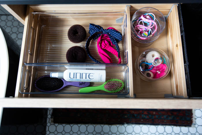 Beautifully organized bathroom supplies and hair accessories! Love these 5 great tips for organizing your drawers. So many practical and functional ideas for how to organize with just a few items. Beautiful stylish organization! #organization #bathroomorganization #modernbathroom #homeorganization