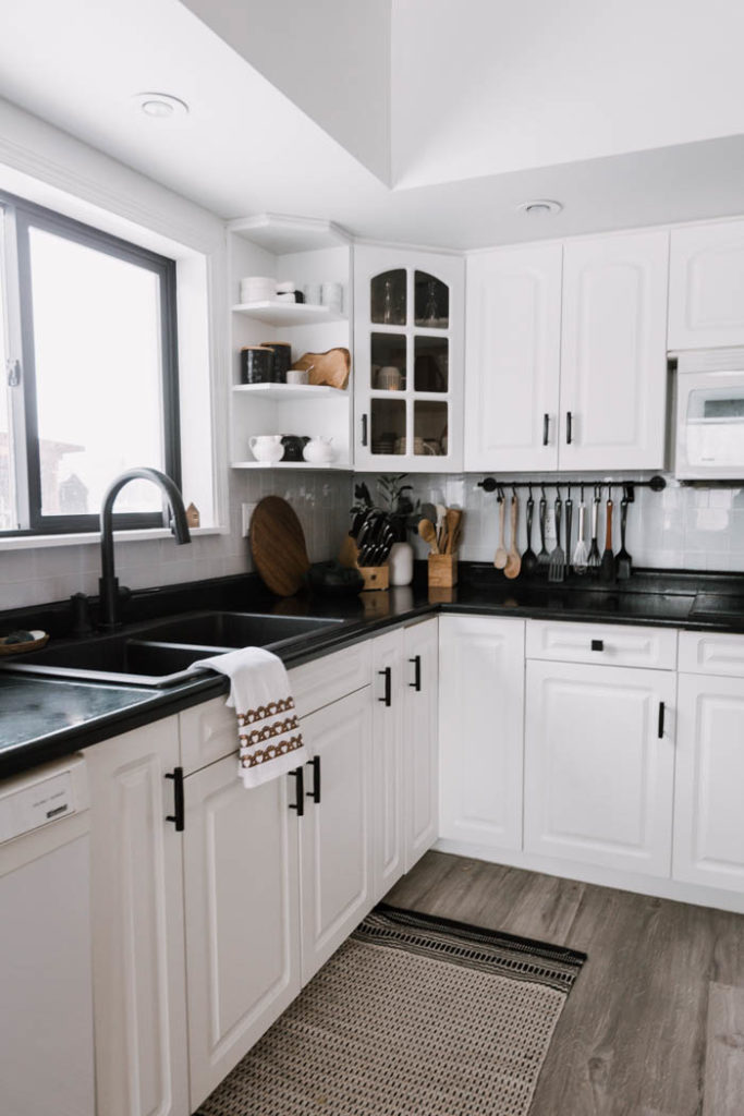 Modern black and white kitchen. Easy Modern Valentine's Day Decor! Add a little love to your home with this easy DIY tea towel using the Cricut and iron-on vinyl or HTV. Love this subtle design and the modern take on Valentine's Day decor. #ValentinesDay #moderndecor #modernvalentinesday #diy #irononvinyl #cricutmade #cricutmarthastewart #cricut