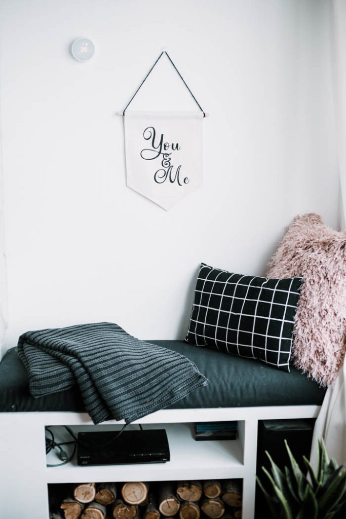 DIY pennant for the living room. Learn how to use Cricut Iron On Vinyl with these simple Valentine's Day project! This simple tutorial will teach you everything you need to know about working with HTV or iron-on vinyl. You will love this DIY Modern Valentine's Day decor pennant. #valentinesday #moderndecor #HTV #Cricutmade #Cricut