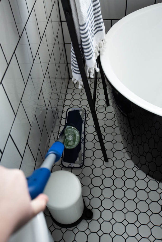 Cleaning white tiles in the bathroom