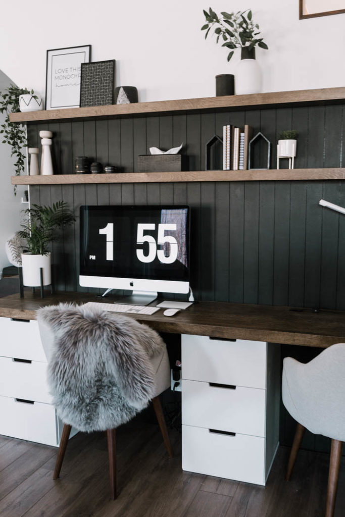 beautiful modern desk space with dark shiplap and brown desk and floating shelves