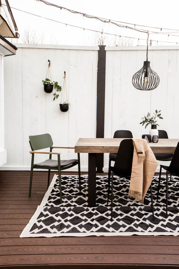 green chairs on a back patio