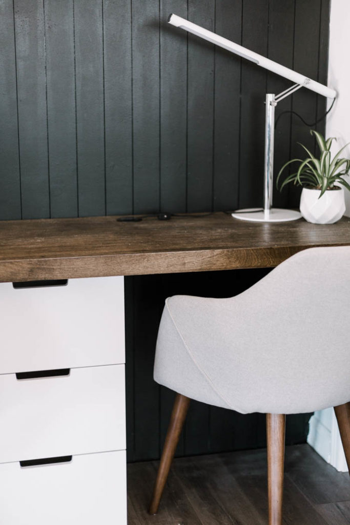 black vertical shiplap behind desk