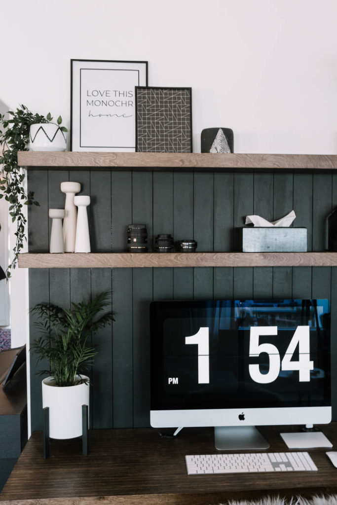 black shiplap wall behind desk