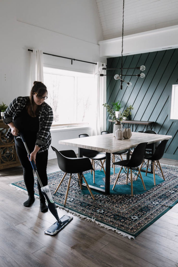 woman using Bona dust mop for laminate floors