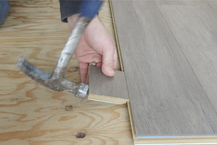 how to hammer laminate flooring in