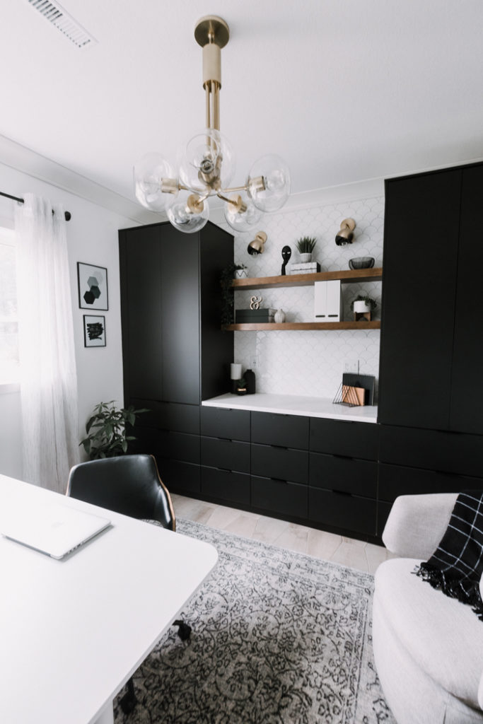 stunning home office with black cabinets