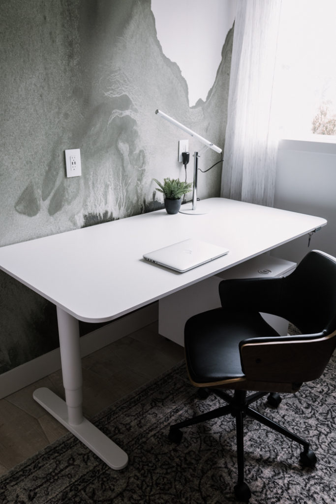 white desk and office mural