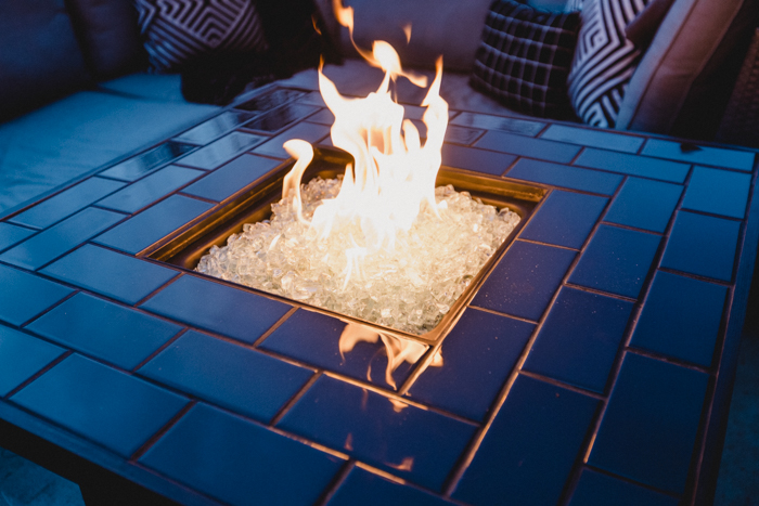 gorgeous black tile and white rock fire pit
