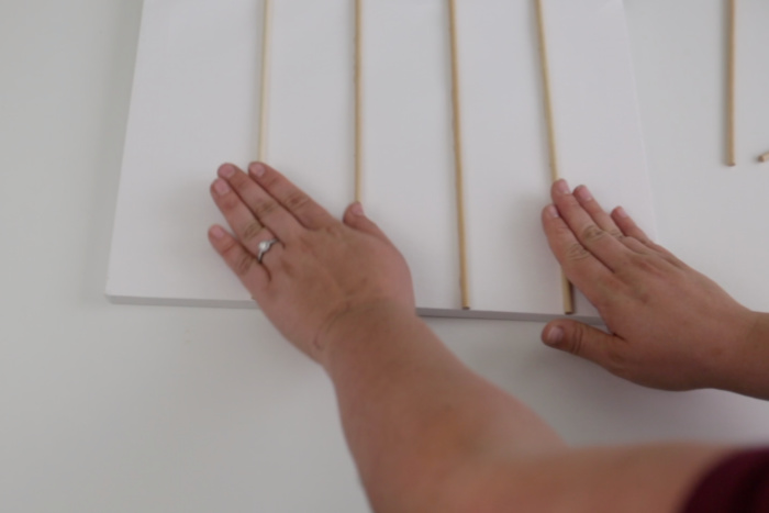 Gluing dowels to a canvas