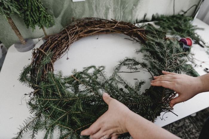 adding branches to grapevine wreath