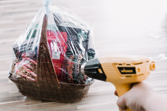 Using a heat gun for a gift basket wrap