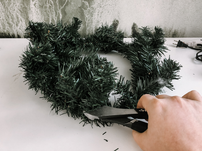 cutting apart a dollar store wreath