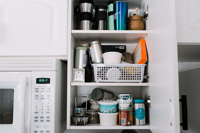 disorganized cupboards before a makeover