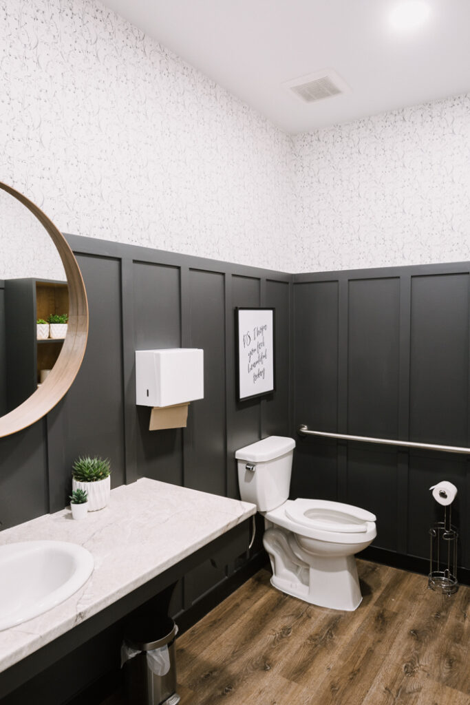 beautiful bathroom with board and batten around entire room