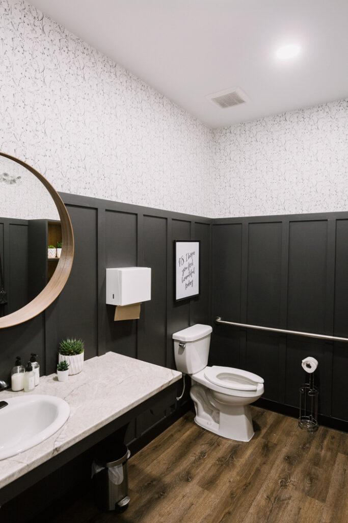 Modern Bathroom with board and batten, and wallpaper