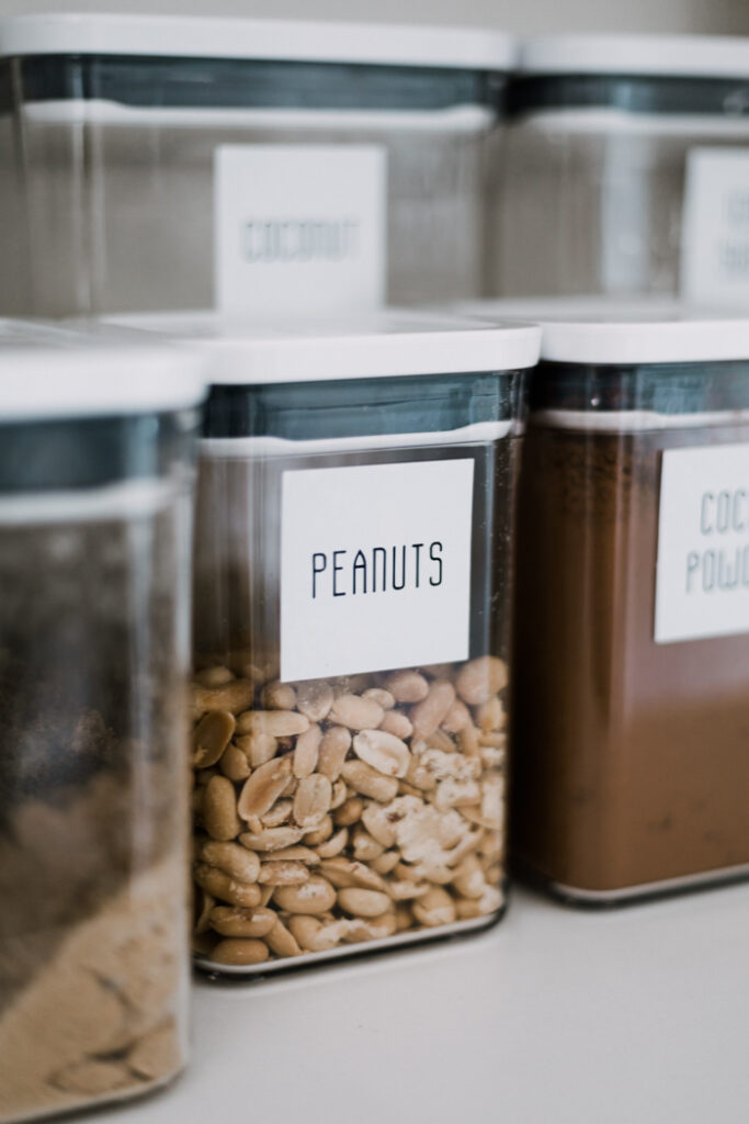 modern pantry labels with large pantry containers to reduce waste at home