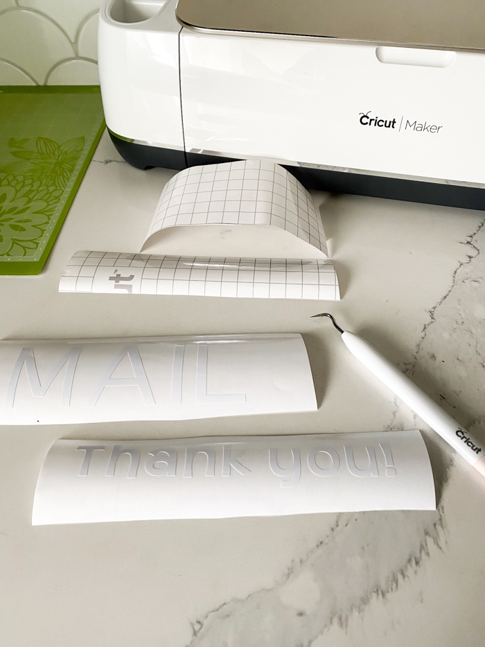 Peeling extra vinyl away with Cricut