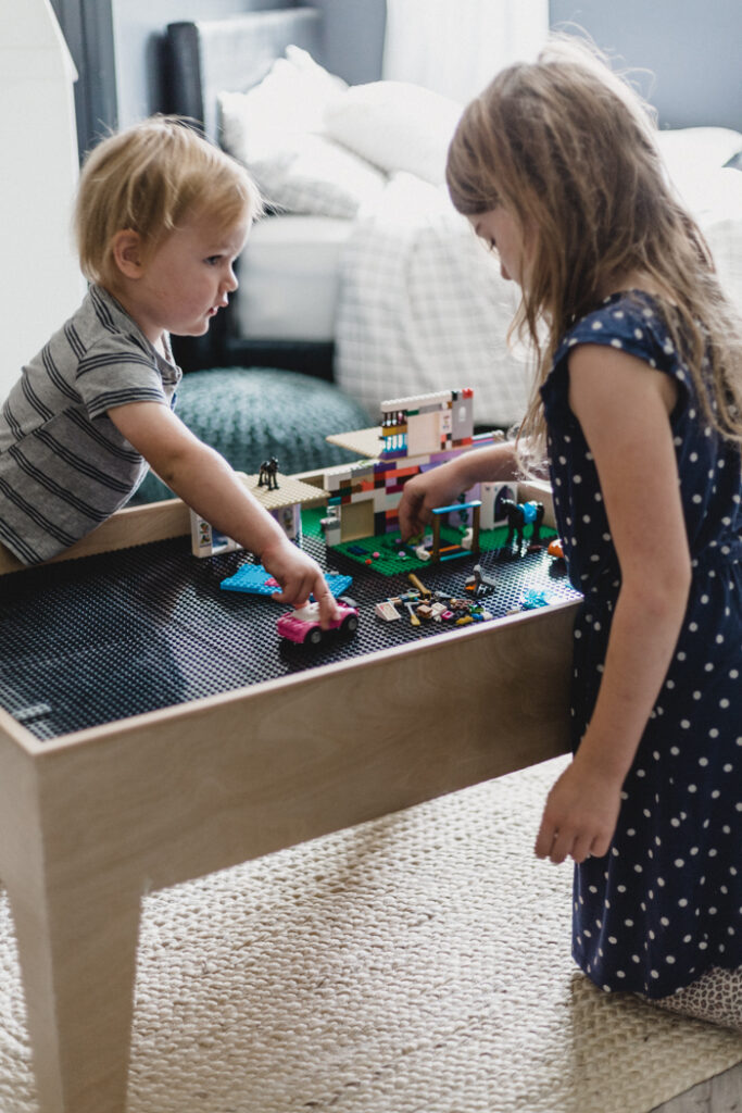 kids playing with modern lego table