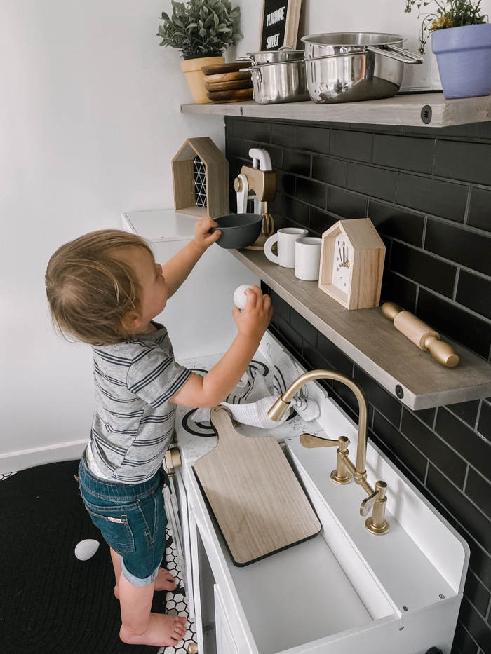 playing in modern kids kitchen