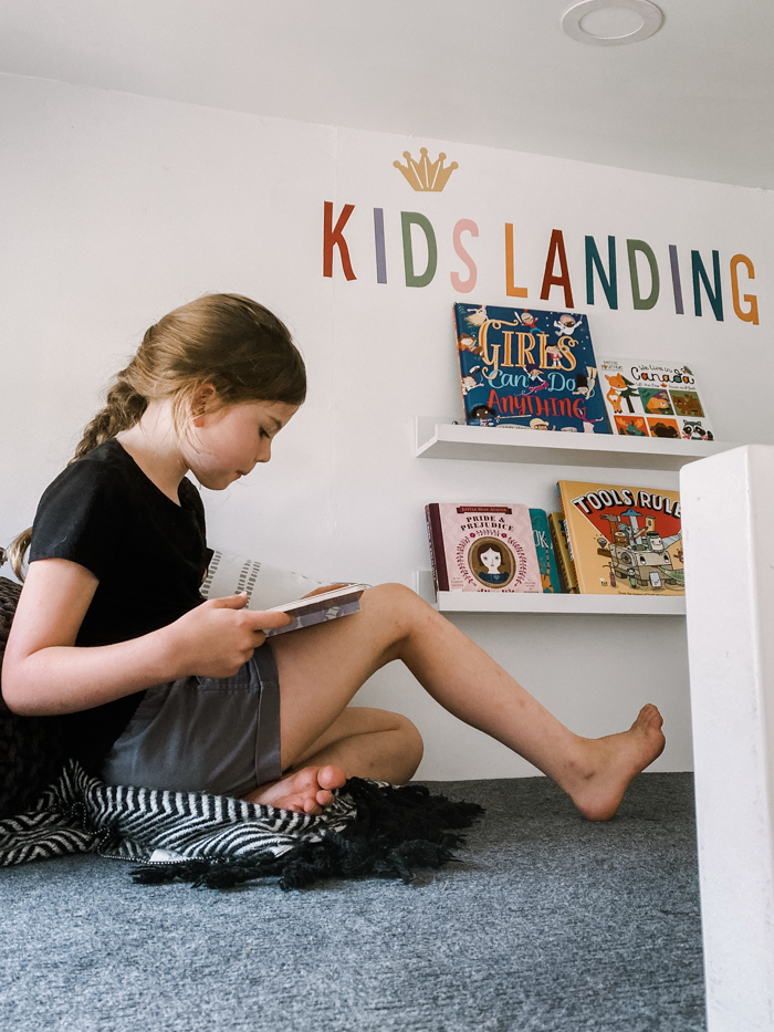 kids reading in playhouse