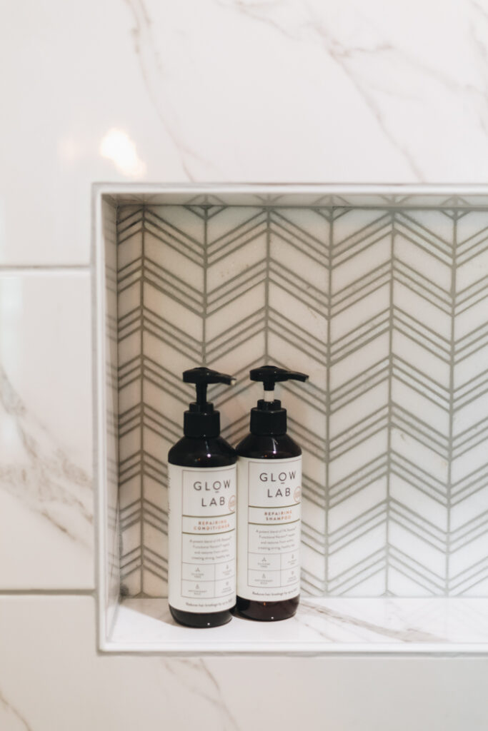 beautiful chevron tile in shower niche