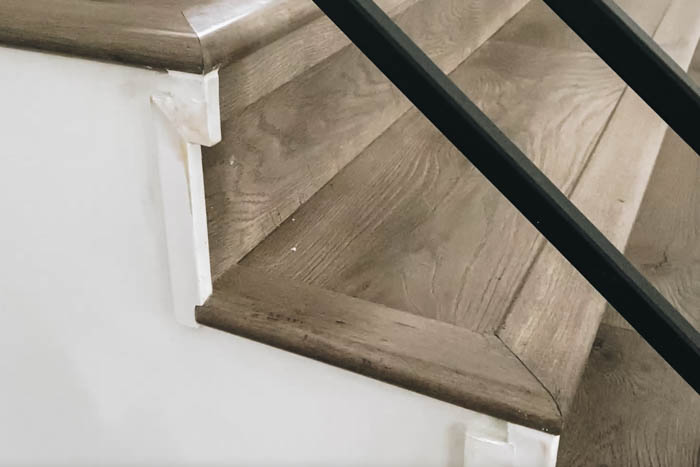 new trim and laminate flooring on stairs