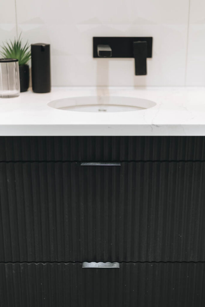 textured black bathroom vanity