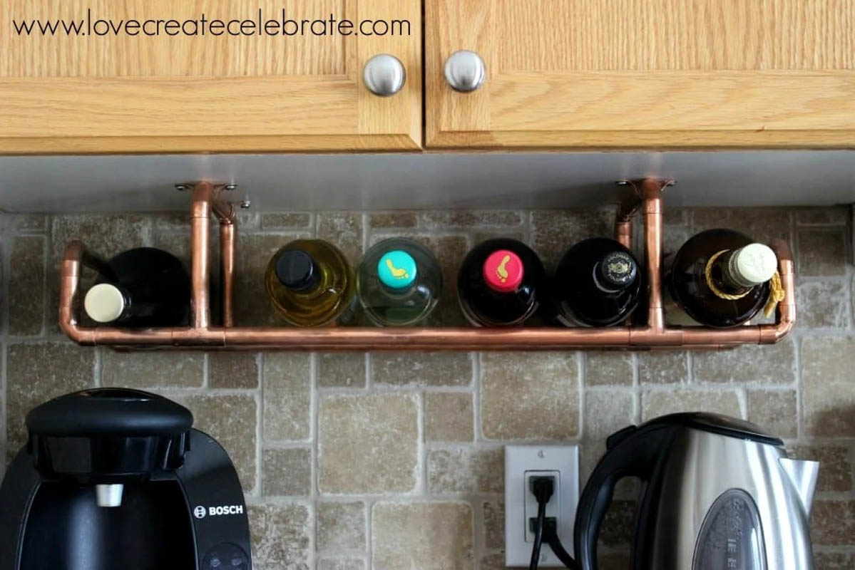 Wine bottles on an installed copper wine rack