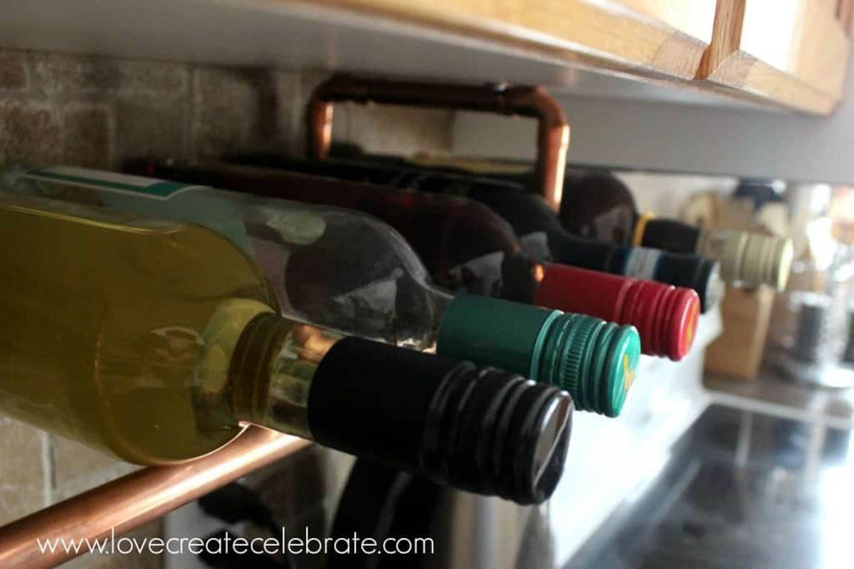 Wine bottles on copper wine rack