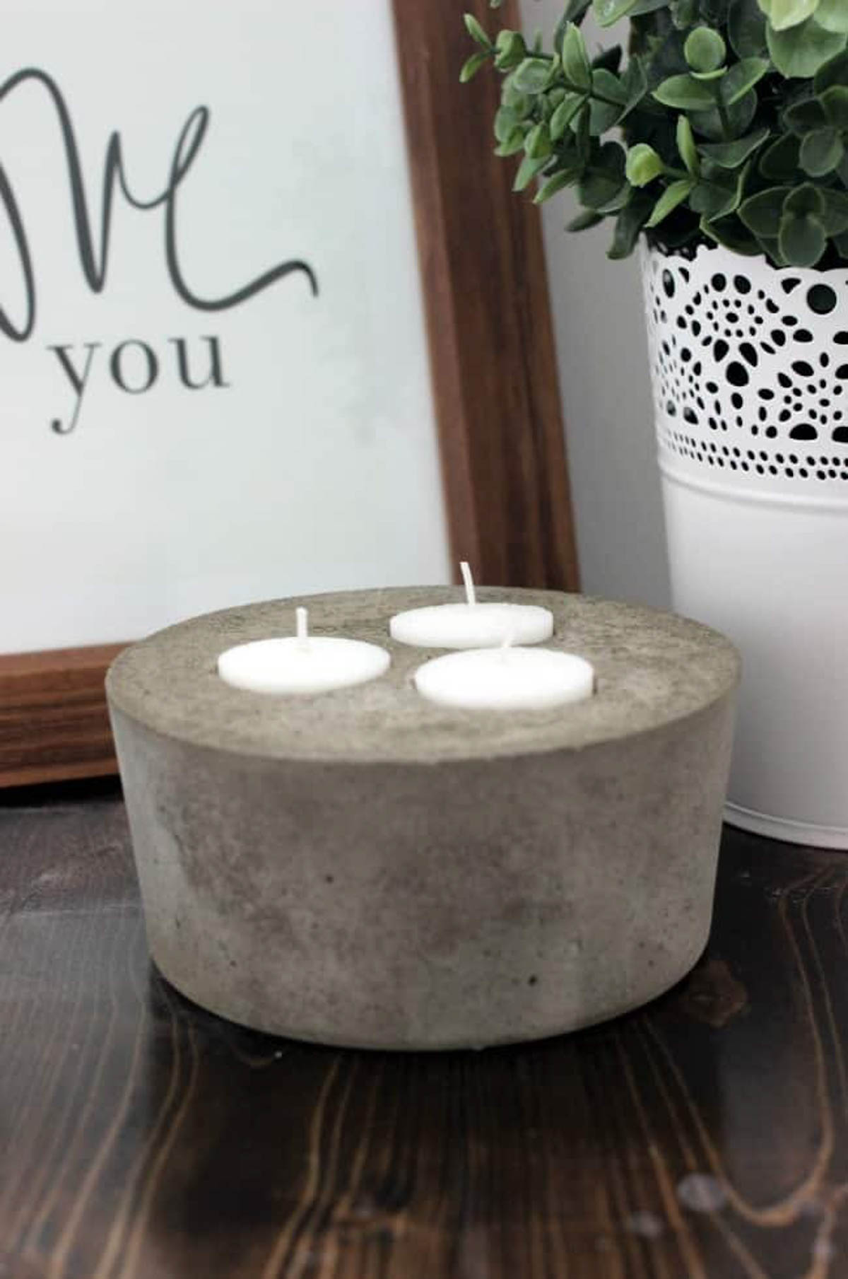 Concrete candle holder with 3 tea light candles