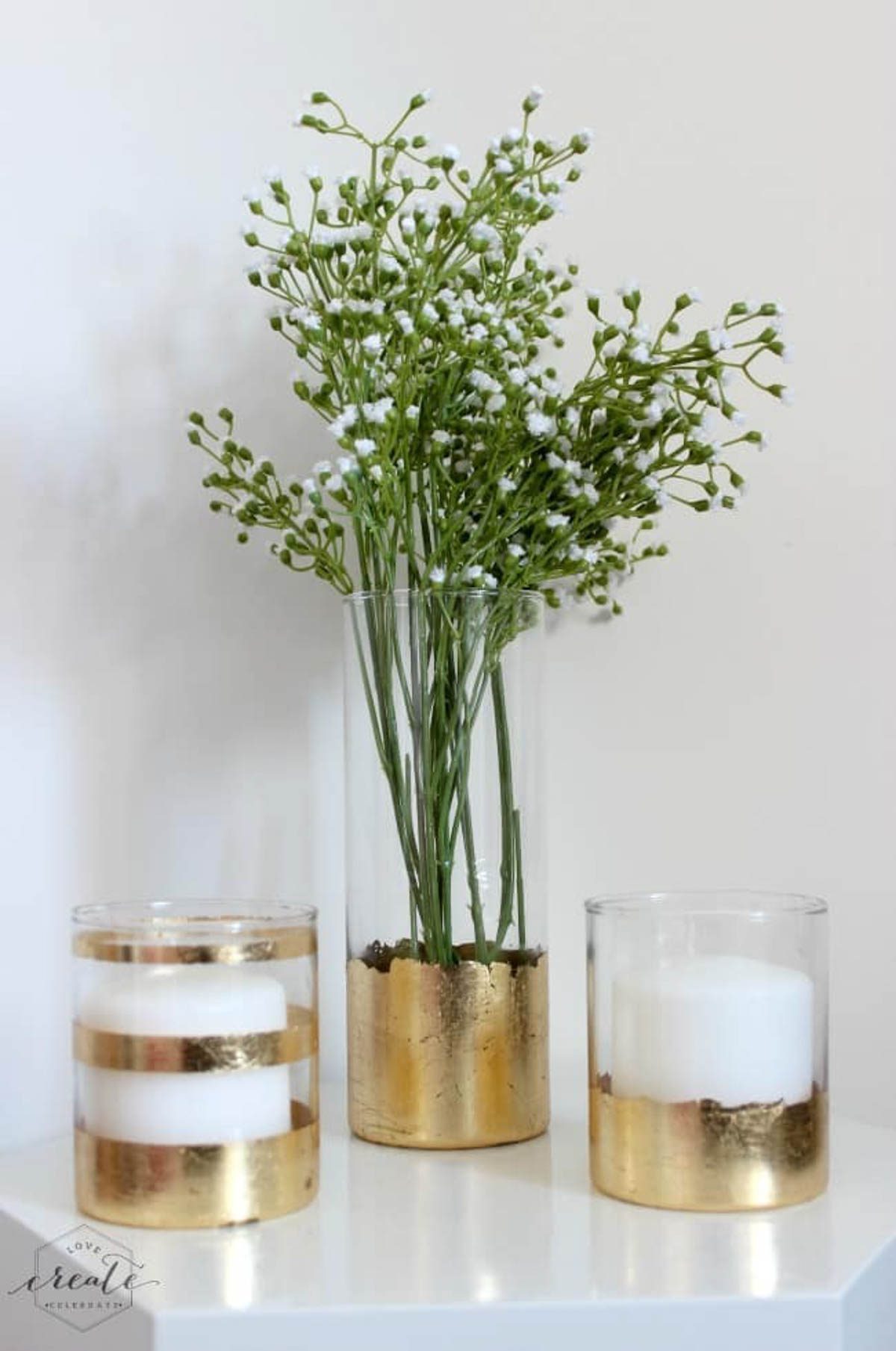 Gold leaf vase with two gold leaf candle holders