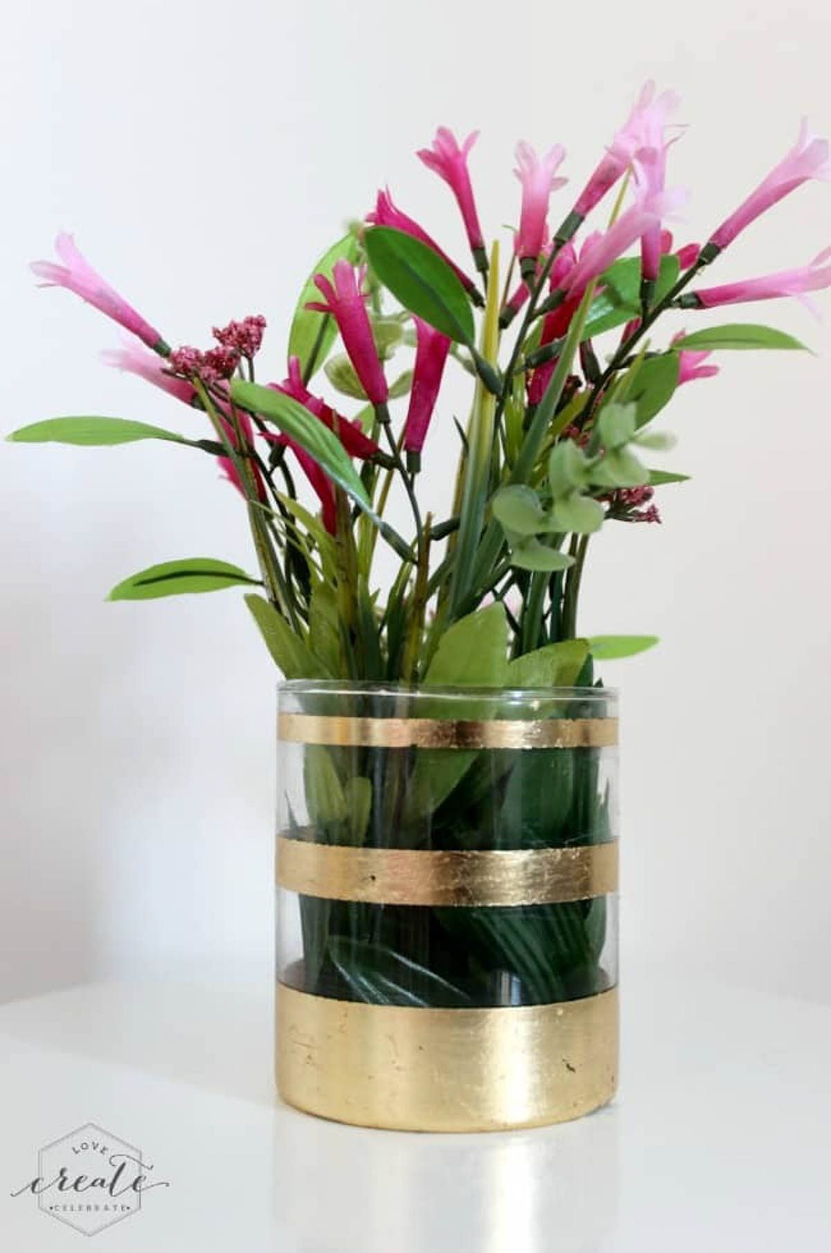 Flower vase with gold leaf design 