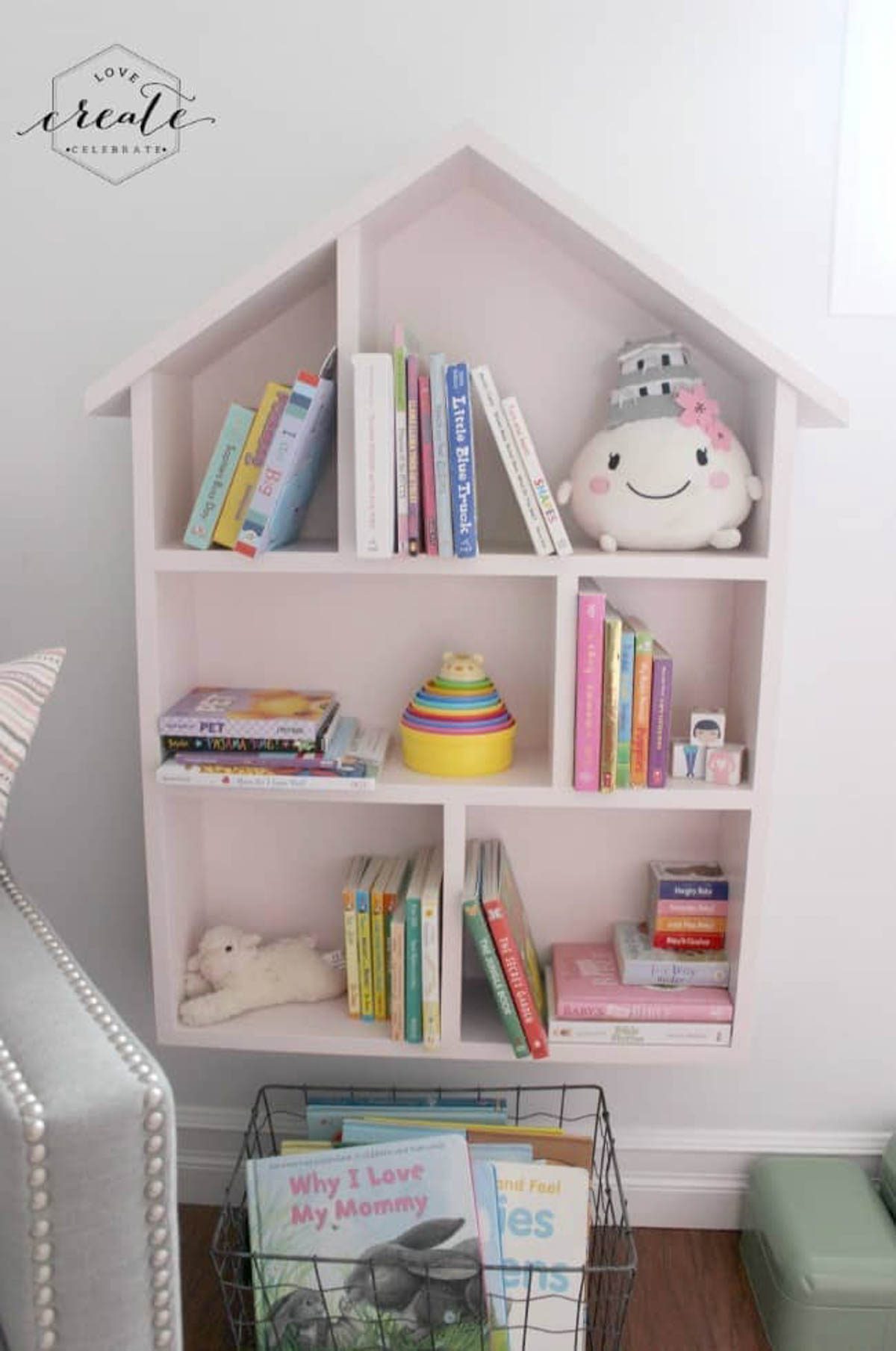 House bookshelf staged with children's books and toys