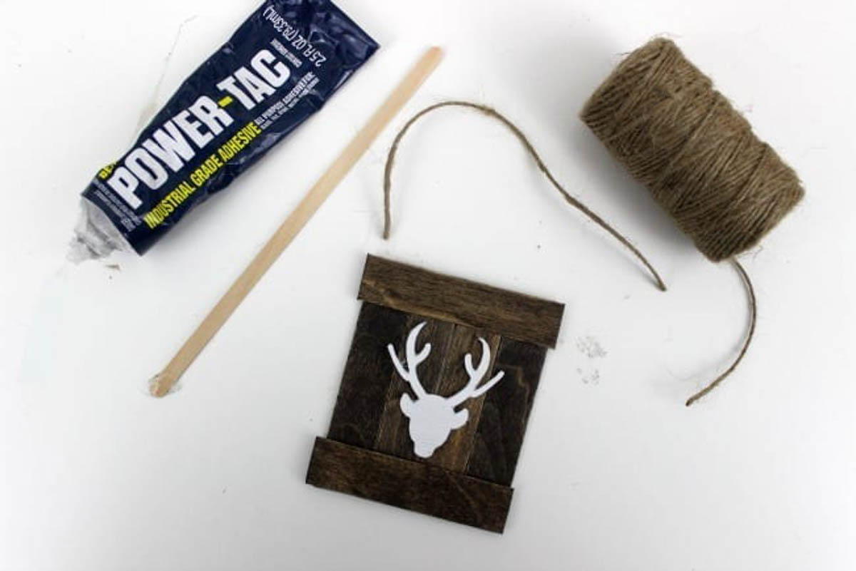 Preparing to put twine on the end of the diy reindeer ornament