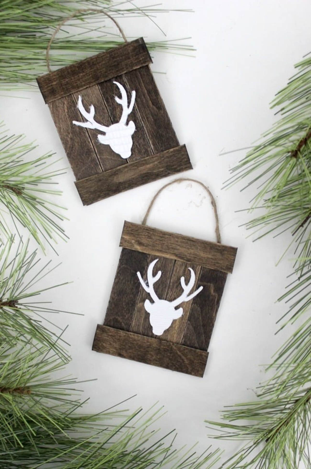 Two completed mini pallet deer ornaments