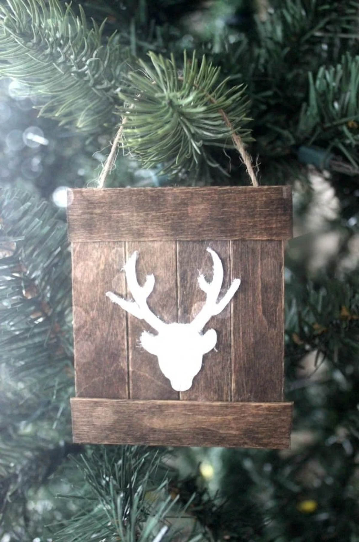 Mini pallet deer ornament hanging on a tree