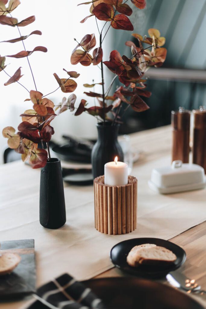 fluted candleholder with candle on the table