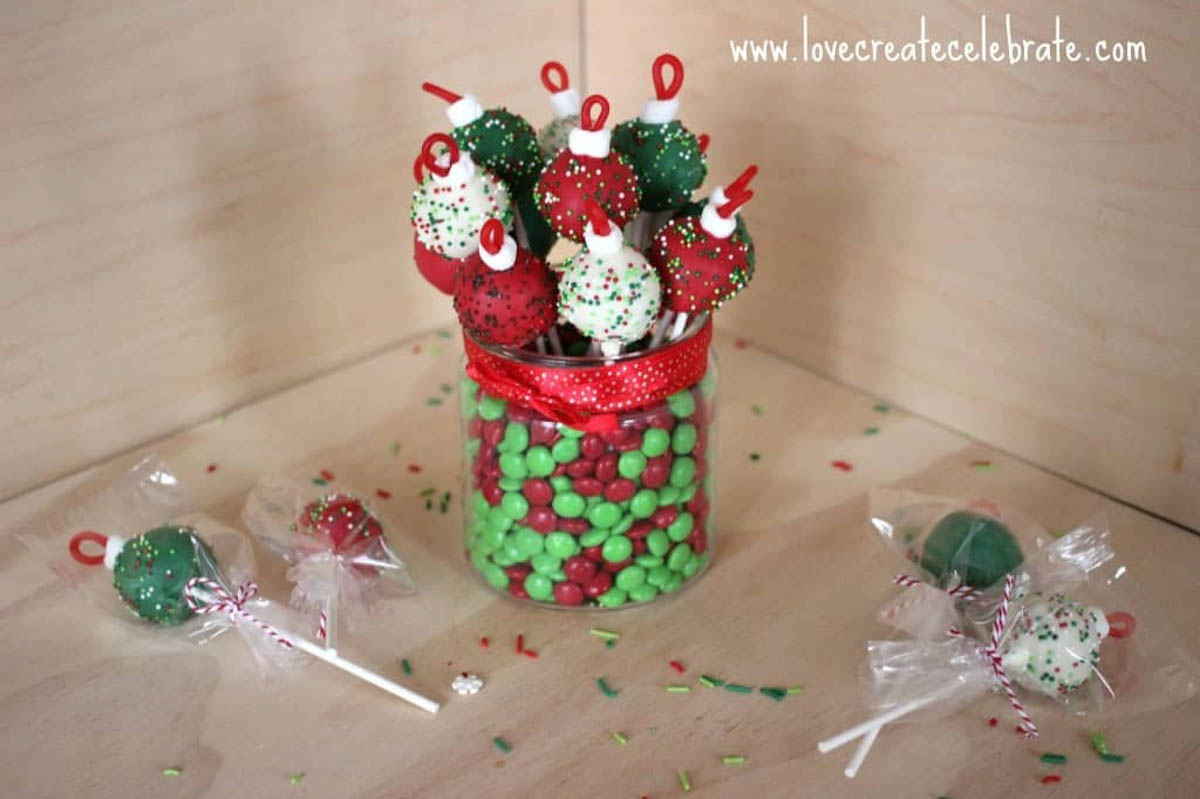 Red, green, and white ornament cake pops in a jar or individually wrapped.