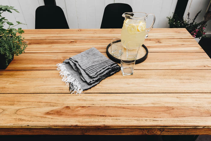 outdoor teak table with lemonade