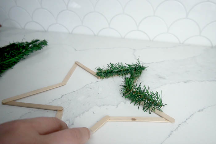 Gluing Garland to Popsicle Sticks