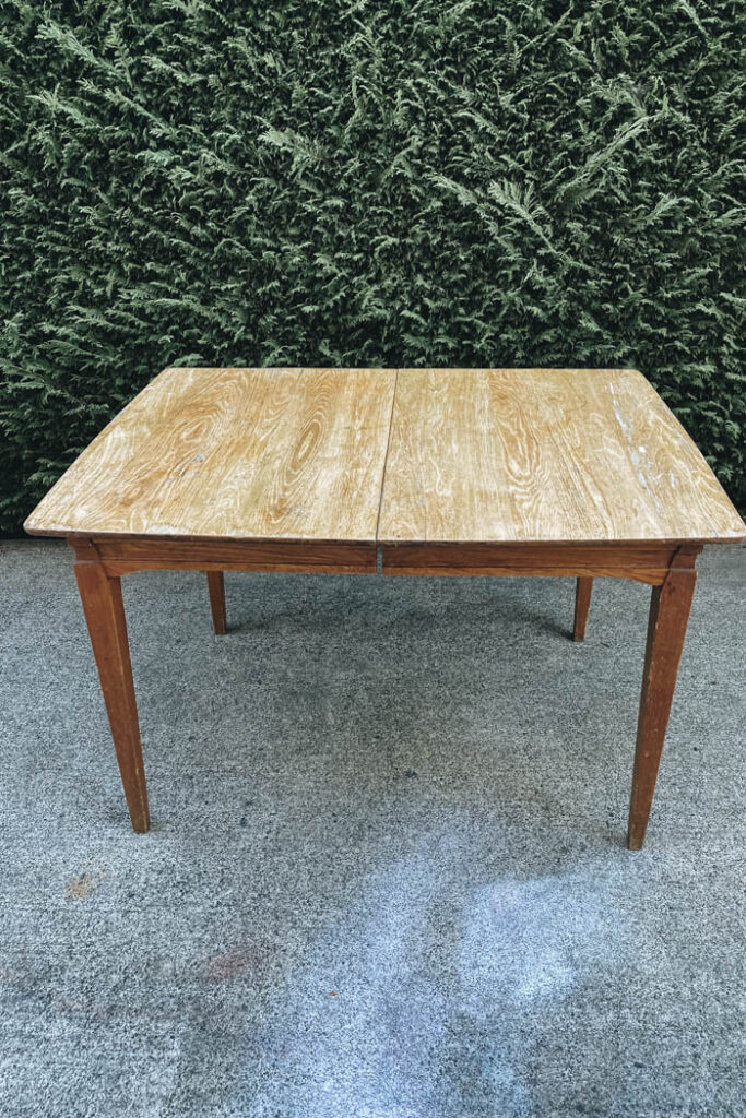 scratched and worn solid oak dinning table