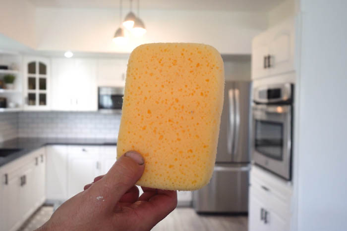 sponge for cleaning up after grouting tiled backsplash