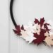 A beautiful modern hoop wreath for Canada Day! Using a simple embroidery hoop and balsa wood maple leaves, you can celebrate the birthday of Canada in style! Love the red, white, and black!
