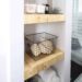 Make your own modern Built-In Shelving with this simple DIY tutorial. Love the natural wood used in this beautiful bathroom renovation! Great tutorial for DIY shelving in the bedroom, living room, or any room!