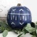Make your own modern fall decor! Use your Cricut Machine and adhesive foil to create these beautiful patterned pumpkins! LOVE the navy, black and white pumpkins for a non-traditional fall!