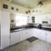 Beautiful Kitchen Decor Ideas for this Modern Kitchen Weekend Transformation! The design plans for this white and black kitchen remodel include countertop transformation kit, peel and stick tile, and beautiful new hardware and fixtures.